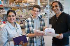three scientists taking a break in the lab