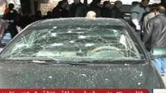 Syrian television showed footage of several damaged cars