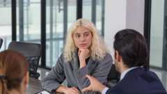 Three people having a meeting in an office