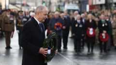 Taoiseach Micheal Martin lays a wreath during a Remembrance Sunday service at the Cenotaph in Enniskillen
