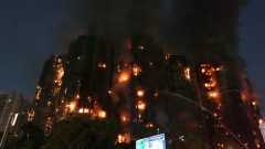 Four killed as fire engulfs Hong Kong high-rise