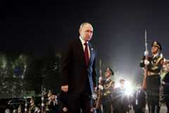 This pool photograph distributed by Russian state owned agency Sputnik shows Russia's President Vladimir Putin arriving for a welcoming ceremony for heads of delegations participating in the Third Belt and Road Forum, hosted by Chinese President and his wife, in Beijing on October 17, 2023. (KONSTANTIN ZAVRAZHIN/POOL/AFP via Getty Images)