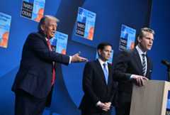US President Donald Trump (L) reacts as US Defense Secretary Pete Hegseth (R) speaks flanked by US Secretary of State Marco Rubio (C) at a press conference during a North Atlantic Treaty Organization (NATO) Heads of State and Government summit in The Hague on June 25, 2025. (BRENDAN SMIALOWSKI/AFP via Getty Images)