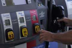 A customer pumps gas at an Exxon gas station, Tuesday, May 10, 2022, in Miami. The national average for a gallon of regular gas has dropped every single day since soaring to a record high of $5.02 a gallon on June 14. (AP Photo/Marta Lavandier)
