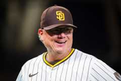 Mike Shildt #8 of the San Diego Padres smiles during their game against the Cincinnati Reds at Petco Park on Tuesday, Sept. 9, 2025 in San Diego, California. (Meg McLaughlin / The San Diego Union-Tribune)
