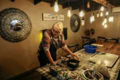 Natalia Kravalis prepares Stuffed Mushroom with Crabmeat at Giardino restaurant in Lemon Grove on Saturday, November 22, 2025.(Photo by Sandy Huffaker for The San Diego Union-Tribune)