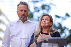 SUT-L-SCHUCK-SETTLEMENT-005 Tim Schuck looks on as his wife Sabrina speaks during a press conference regarding a lawsuit from the death of their son, William Hayden Schuck, outside San Diego Central Jail on Wednesday, Oct. 29, 2025 in San Diego. (Meg McLaughlin / The San Diego Union-Tribune)