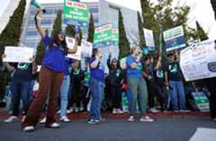Nurses picket outside of Sharp Memorial Hospital. Over 5,700 Sharp Health Care nurses started a three-day strike on November 26.  (K.C. Alfred / The San Diego Union-Tribune)