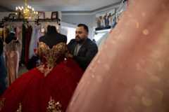 sut-l-dressmaker-immigration-3 Owner Osmar Naranjo changes a quinceañera dress on a mannequin at Cynderella Brides on Thursday, Nov. 20, 2025 in Chula Vista. (Ana Ramirez / The San Diego Union-Tribune)