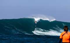 Encinitas surfer Katie McConnell drops down a massive wave during the “Thrillers at Killers” surf contest held off Ensenada, Mexico. McConnell won the event for the second time. (Photo courtesy of Billy Watts Photography)