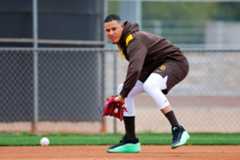 SUT-L-SpringTraining-Day4-037 Manny Machado #13 of the San Diego Padres fields the ball during spring training workouts at the Peoria Sports Complex on Friday, Feb. 13, 2026 in Peoria, Ariz.. (Meg McLaughlin / The San Diego Union-Tribune)