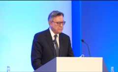 jose speaking in a microphone