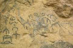 Glyphs painted on cave walls