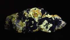 Afghanite specimen shown under ultraviolet light