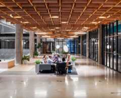 A group of people having a meeting in a lobby