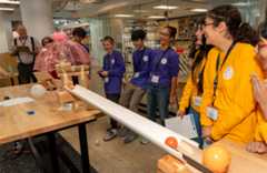 2025 Thermo Fisher purple team and gold team are all smiles seeing the contraption kick start.