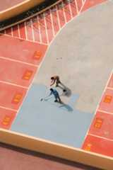 Two People Are Painting The Concrete Between The Lanes