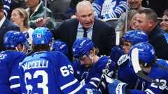 Toronto Maple Leafs head coach Craig Berube speaks with this players during a timeout in second period NHL hockey action against the Nashville Predators in Toronto on Tuesday, October 14, 2025. (Nathan Denette/CP)