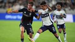 San Diego FC defender Oscar Verhoeven, left, battles Vancouver Whitecaps defender Mathías Laborda for the ball during the first half of an MLS soccer match Saturday, July 19, 2025, in San Diego. (Gregory Bull/AP)
