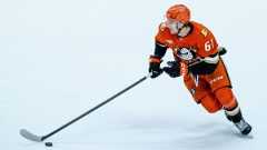 Anaheim Ducks left winger Cutter Gauthier controls the puck against the Boston Bruins during the second period of an NHL game Wednesday, Nov. 19, 2025, in Anaheim, Calif. (AP Photo/Ethan Swope)
