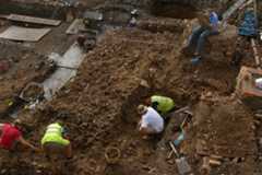 The excavation of a collapsed wall from the Roman macellum at Highcross Street in 2006 - University of Leicester Archaeological Services