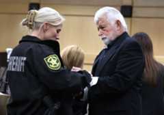 plea , hearing, Bianculli Louis Bianculli, of Lighthouse Point, is handcuffed on Jan. 16, 2025, after pleading guilty to charges of sexual battery and video voyeurism. (Carline Jean/South Florida Sun Sentinel file)