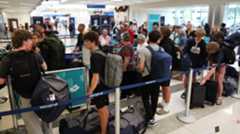 airport, travel Passengers wait in the line at the Canadian airline WestJet at Fort Lauderdale-Hollywood International Airport on Monday. South Florida airports expect record numbers of travelers during Thanksgiving week. (Carline Jean/South Florida Sun Sentinel)