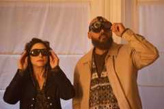(l-r) Rochelle (Joy Tanner) and August Ripley (Maurice Dean Wint) peer up through special goggles in SurrealEstate 210