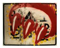 A graffiti tag of a clawed paw over a street sign