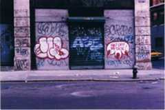 A streetside with graffiti tags