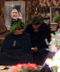Wreathed mourners at Sir Robert Mahuta's tangi
