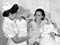 Nurse Erina Heremaia with mother and twins