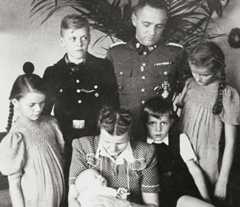 Rudolf Höß and his family at their Auschwitz villa. (Rainer's father, Hans-Jürgen, is sitting next to his mother Hedwig.)