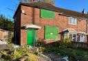A boarded up house in Bolton