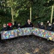 Emily Morgan, our Nursery Manager, appears with our nursery children.