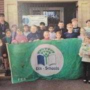 Highfield Primary School Eco-Team with their new award The Green Flag Distinction plaque