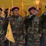 Hezbollah fighters shout slogans during the funeral procession of Hezbollah’s chief of staff Haytham Tabtabai (Hussein Malla/AP)