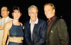Ghislaine Maxwell, Jeffrey Epstein, and musician Michael Bolton pose for a portrait during a party at the Mar-a-Lago club, Palm Beach, Florida, February 12, 2000.