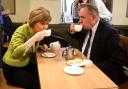 Nicola Sturgeon enjoys a cup of tea with Alex Salmond while on the General Election campaign trail in Inverurie in 2015