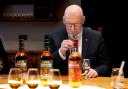First Minister John Swinney pictured with Scottish whisky