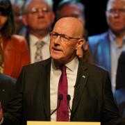 First Minister John Swinney speaking at the SNP's 2026 Holyrood campaign launch