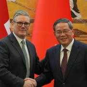 Prime Minister Keir Starmer (left) and Chinese premier Li Qian shake hands at the Great Hall of the People in Beijing