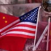 China and US national flags (Andy Wong/AP)
