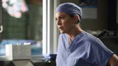 Meredith (Ellen Pompeo) in the scrub room wearing a scrub cap looking concerned on Grey's Anatomy