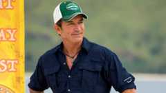 Jeff Probst in a blue shirt looking to the side during a challenge on Survivor