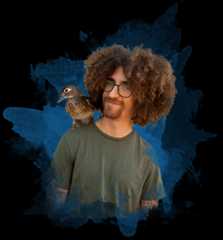 A male student poses with a duck on his shoulder