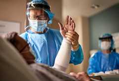 UMC Lions Burn Care Center doctor tending to patient