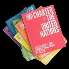 a stack of colorful UN charter books