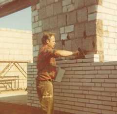 Egon Petersen building his house