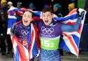 Tabby Stoecker and Matt Weston celebrate their gold medal (Andrew Milligan/PA).